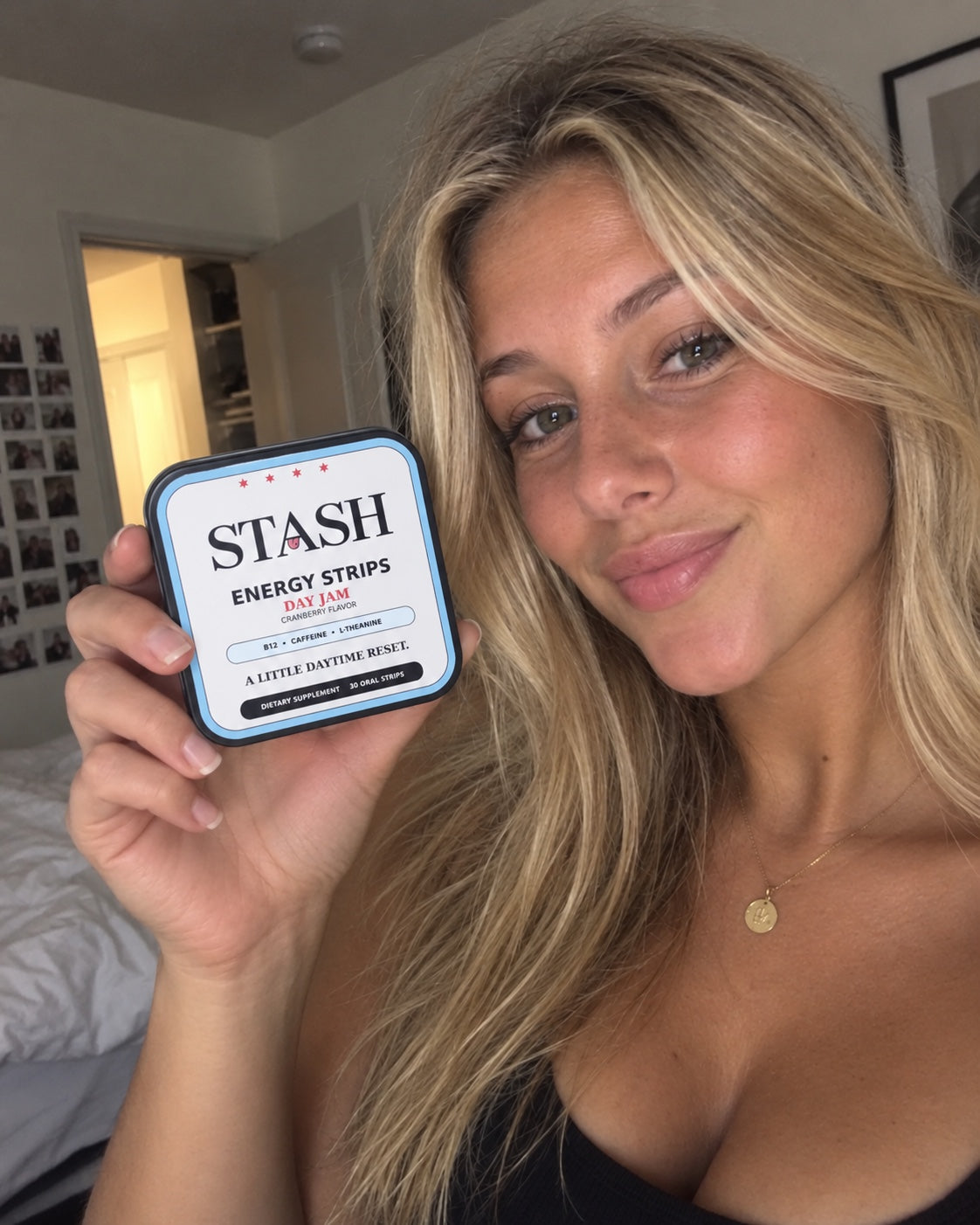 Lifestyle photo holding STASH Day Jam energy strips tin